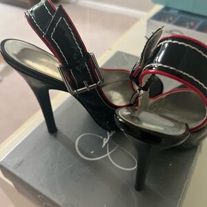 Jessica Simpson Paton leather black heels. 7.5 red trim buckled strap back